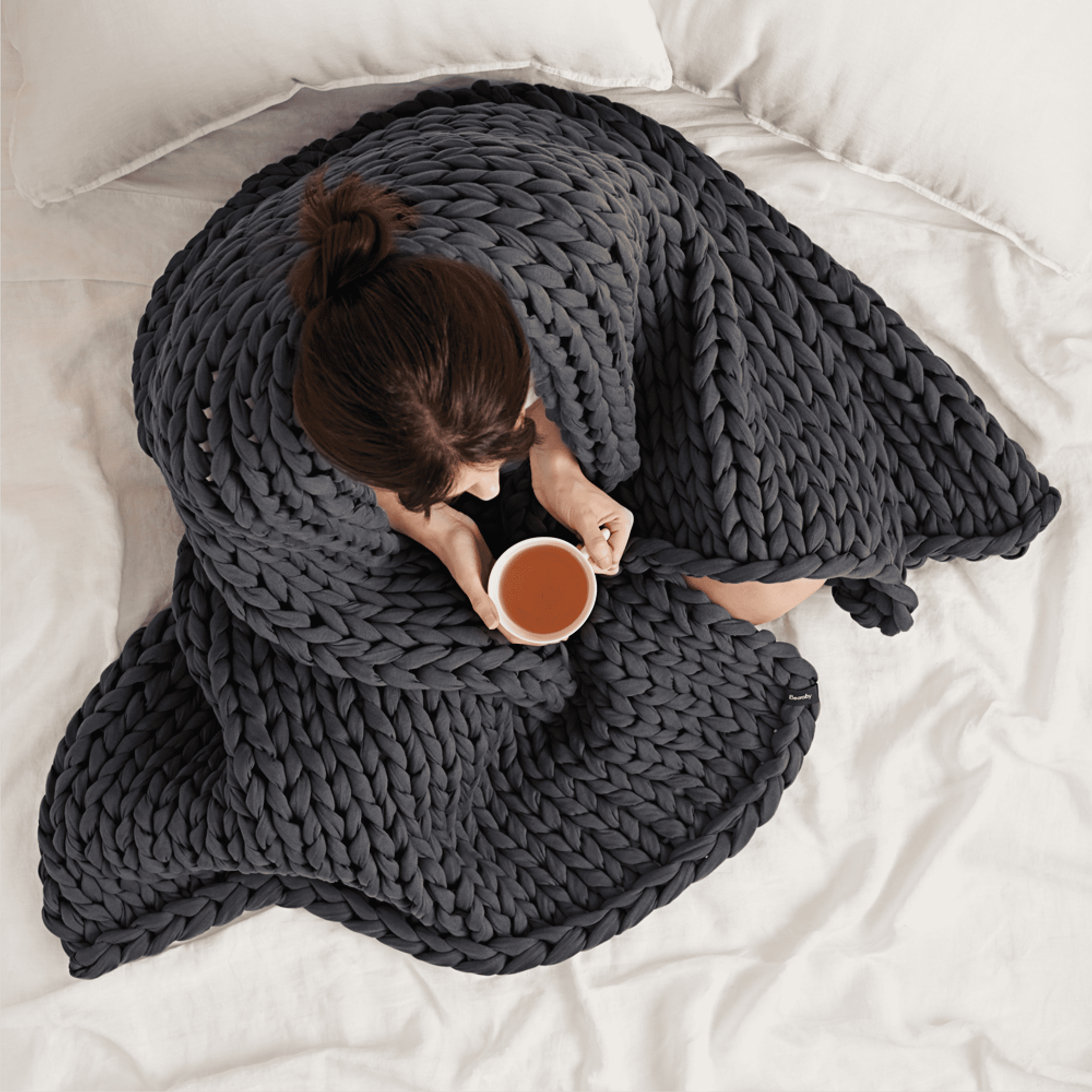women wrapped in bearaby grey blanket women wrapped in bearaby grey blanket
